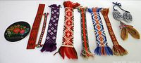 Full lot showing ceramic disc, seven bookmarks, mini mittens, mini pastlad