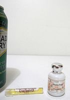 Can for scale with mini bottle and sample vial of Anais Anais