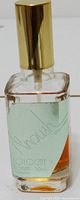 Front view of A'noush cologne bottle showing label, cap and fill level