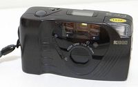 Front view of Ricoh FF-9 showing lens, flash, branding