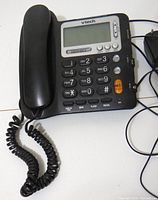 Front view of VTech CD1281 phone showing handset, keypad, LCD screen