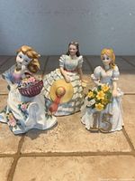 All three porcelain lady figurines front view