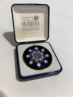 Brooch in open Antica Murrina box, front view