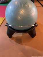 Stability ball seated in wheeled base, frontal view