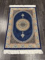 Full view of rug showing overall design, size, fringes