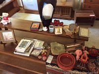 Overview of collection including TY Beanie Babies, pottery, framed artwork, decorative pieces, and small collectibles on wooden shelves.