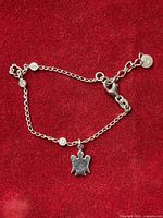 Full view of sterling silver bracelet with angel charm and extension chain