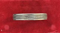 Top view of 900 silver cuff showing braided rope and beaded edge pattern