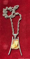 Full view of pendant hung on chain