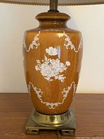 Lower portion showing ceramic body attached to brass base and cord exit
