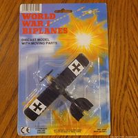 Front view of sealed blister pack showing biplane and packaging details