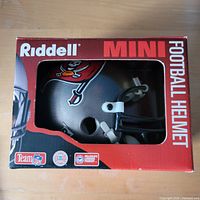 Front view of boxed Tampa Bay Buccaneers Riddell mini helmet