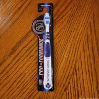Front of sealed Toronto Maple Leafs toothbrush in packaging
