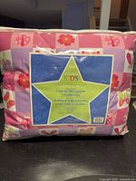 Front view of sealed comforter set package showing Divatex Kids label and pattern