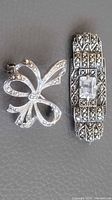 Front view of both sterling silver marcasite brooches