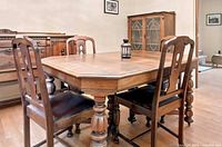 dining table and four of the six chairs visible