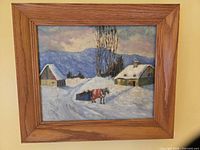 Full view of framed oil painting showing entire winter scene and wood frame