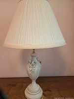 Full view of porcelain lamp with shade
