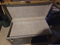Open trunk showing plaid interior lining