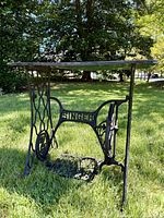 Side view of table showing Singer cast iron base and top