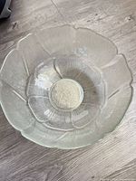top view of clear glass bowl showing petal rim and ribbed interior