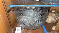 Punch bowl with ladle and cups inside cabinet