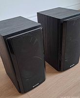 Front view of both Sharp bookshelf speakers