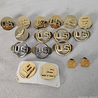 Group shot of all pins showing finishes and designs