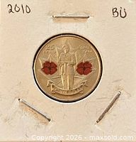 Coin in cardboard holder marked 2010 BU showing reverse design