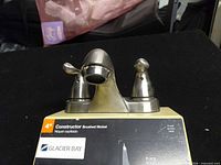 Front view of Glacier Bay Constructor faucet on box