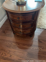 Front view showing three drawers and brown mahogany finish