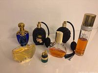 All seven perfume bottles front view