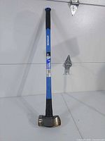 Full view of Kobalt sledge hammer standing upright