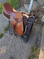 Full view of saddle on stand showing overall condition