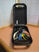 clipper and combs inside open black case