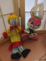 Both plush dolls side by side showing overall design and size