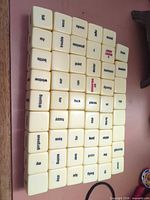 Front view showing all Haikubes word cubes arranged in grid
