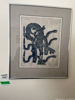 Full view of framed artwork showing matting and frame