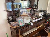 Overall view of lot on sideboard showing candles, napkins, utensils, decor items