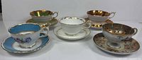 All five teacup and saucer sets front view