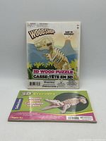 Front view of both sealed 3D wooden puzzle kits