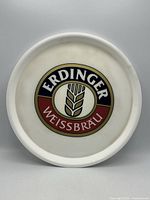 Front of white plastic tray showing Erdinger Weissbräu logo