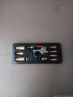 plastic tray with full kit showing air blow gun and brass fittings