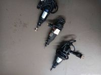 All three Dremel rotary tools laid out, cords visible