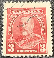 Close-up of the red 3-cent King George V stamp showing design details and postmark