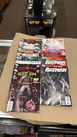 Left stack showing The Dark Knight and Streets of Gotham issues