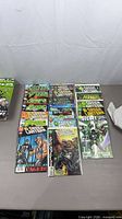 Overall lot of bagged Green Lantern comics laid out on table