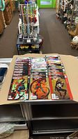 Stacked view of Ultimate Spider-Man comic run displayed on counter