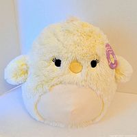 Front view of Squishmallow Aimee chick plush, tag visible