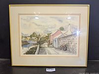 Full view of framed print behind glass